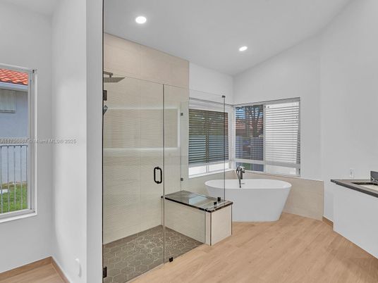 Bathroom, Free Standing Baths, Glass Shower, Interior, Recessed Lighting, Wood Texture Flooring