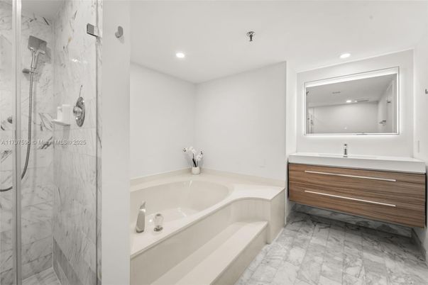 Bathroom, Dual Sink Vanities, Glass Shower, Interior, Marble, Marble Walls, Recessed Lighting