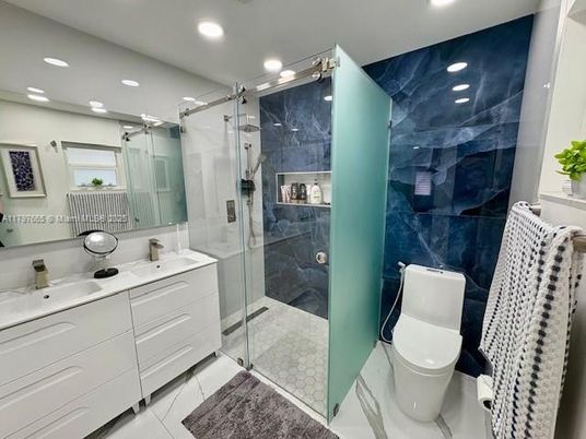 Bathroom, Dual Sink Vanities, Glass Shower, Interior, Marble Walls, Recessed Lighting