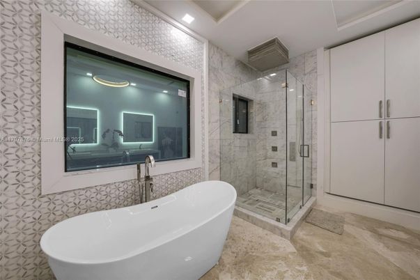 Bathroom, Free Standing Baths, Glass Shower, Interior, Marble Walls, Recessed Lighting