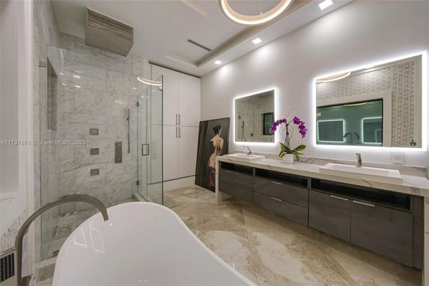 Bathroom, Dual Sink Vanities, Free Standing Baths, Glass Shower, Interior, Marble Walls, Recessed Lighting