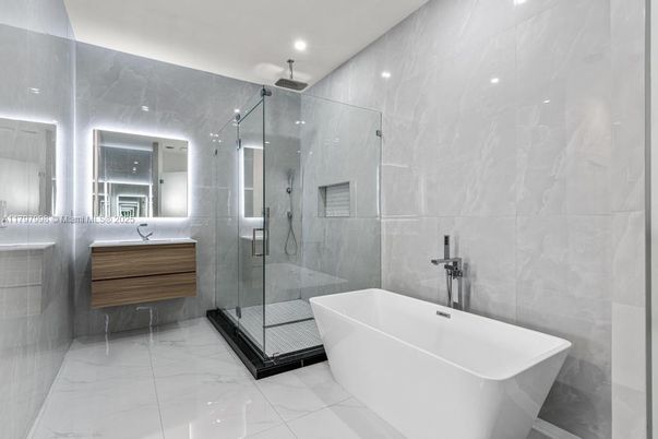 Bathroom, Free Standing Baths, Glass Shower, Interior, Marble, Marble Walls, Recessed Lighting