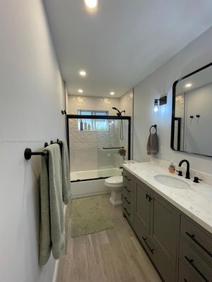 Bathroom, Dual Sink Vanities, Glass Shower, Interior, Recessed Lighting, Wood Texture Flooring