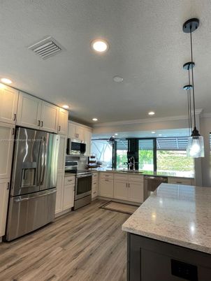 Interior, Kitchen, Pendant Lights, Recessed Lighting, Stainless Steel Appliances, Wood Texture Flooring