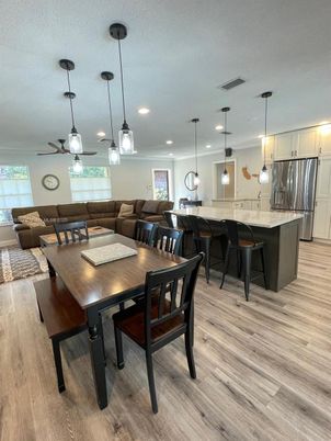 Dining room, Interior, Kitchen, Living room, Pendant Lights, Recessed Lighting, Stainless Steel Appliances, Wood Texture Flooring