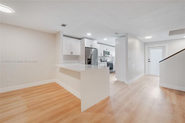 Interior, Kitchen, Recessed Lighting, Stainless Steel Appliances, Wood Texture Flooring