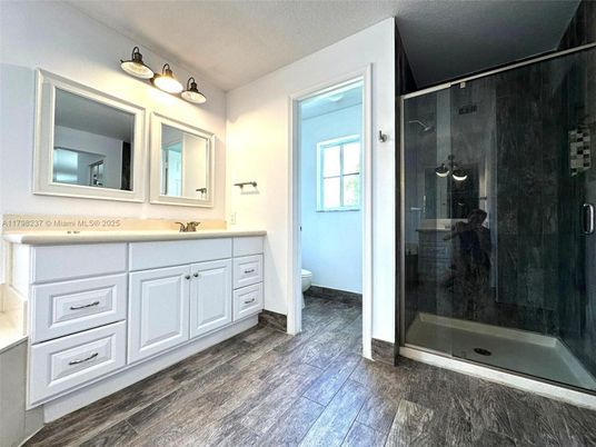 Bathroom, Dual Sink Vanities, Glass Shower, Interior, Wood Texture Flooring