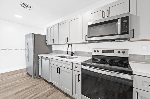 Interior, Kitchen, Recessed Lighting, Stainless Steel Appliances, Wood Texture Flooring