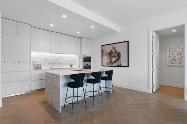 Interior, Kitchen, Marble Walls, Recessed Lighting, Stainless Steel Appliances, Wood Texture Flooring