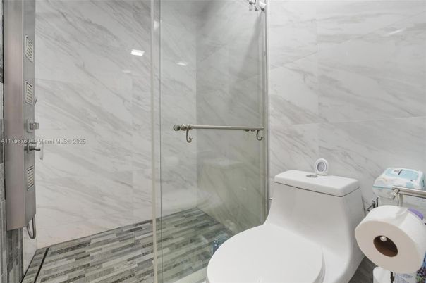 Bathroom, Glass Shower, Interior, Marble Walls, Wood Texture Flooring