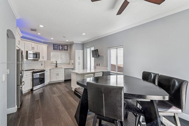 Dining room, Interior, Kitchen, Recessed Lighting, Stainless Steel Appliances, Wood Texture Flooring