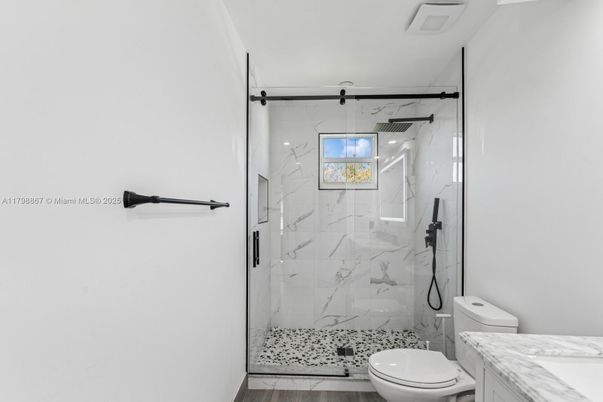 Bathroom, Glass Shower, Interior, Marble Walls, Recessed Lighting, Wood Texture Flooring