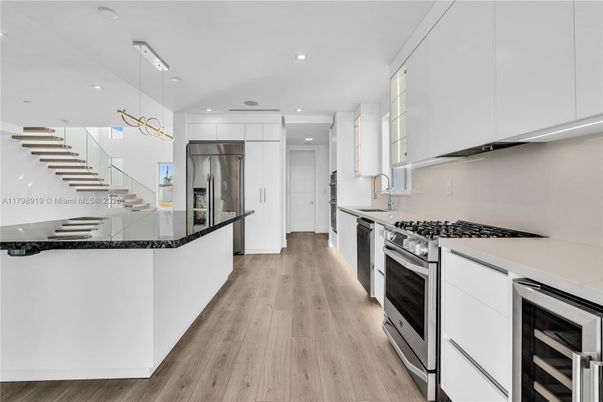 Interior, Kitchen, Pendant Lights, Recessed Lighting, Stainless Steel Appliances, Wood Texture Flooring