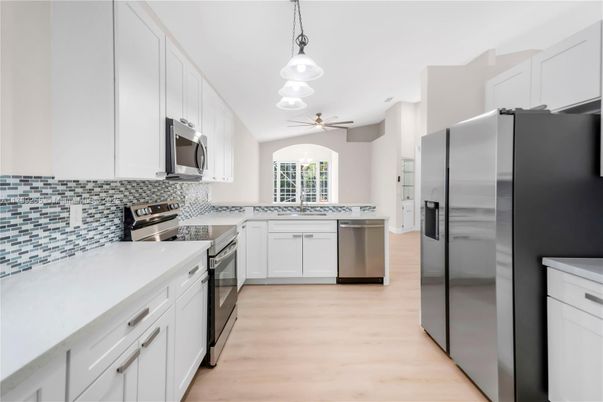Interior, Kitchen, Pendant Lights, Recessed Lighting, Stainless Steel Appliances, Wood Texture Flooring