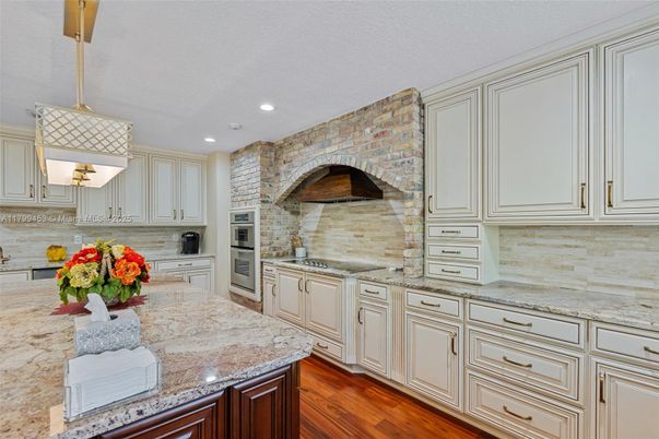 Interior, Kitchen, Pendant Lights, Recessed Lighting, Stainless Steel Appliances, Stone Walls, Wood Texture Flooring