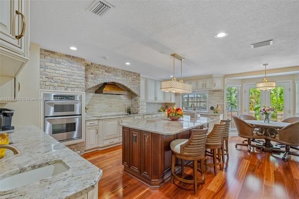 Dining room, Interior, Kitchen, Pendant Lights, Recessed Lighting, Stainless Steel Appliances, Stone Walls, Wood Texture Flooring