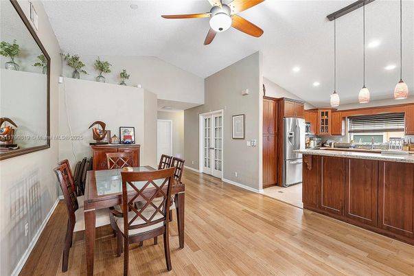 Dining room, Interior, Kitchen, Pendant Lights, Recessed Lighting, Stainless Steel Appliances, Wood Texture Flooring