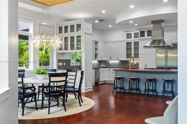 Chandelier, Dining room, Interior, Kitchen, Pendant Lights, Recessed Lighting, Stainless Steel Appliances, Wood Texture Flooring