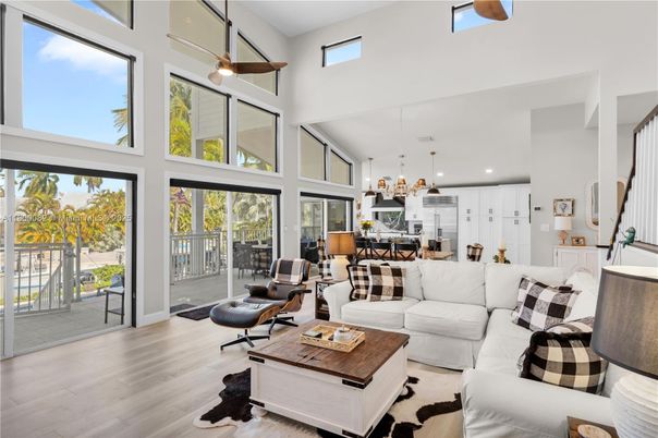 Chandelier, Dining room, Interior, Kitchen, Living room, Pendant Lights, Recessed Lighting, Stainless Steel Appliances, Wood Texture Flooring