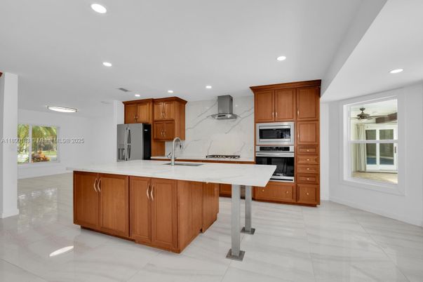 Interior, Kitchen, Marble Walls, Recessed Lighting, Stainless Steel Appliances