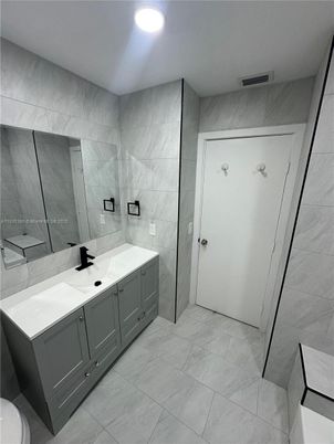 Bathroom, Dual Sink Vanities, Glass Shower, Interior, Marble Walls, Recessed Lighting