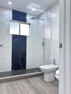 Bathroom, Glass Shower, Interior, Marble Walls, Recessed Lighting, Wood Texture Flooring