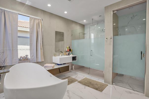 Bathroom, Free Standing Baths, Glass Shower, Interior, Marble, Marble Walls, Recessed Lighting