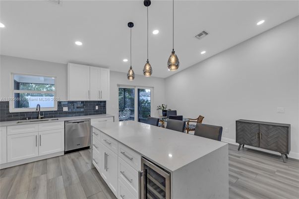 Dining room, Interior, Kitchen, Pendant Lights, Recessed Lighting, Stainless Steel Appliances, Wood Texture Flooring