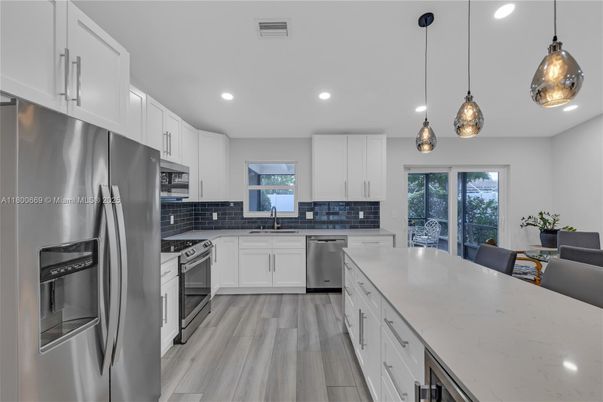 Interior, Kitchen, Pendant Lights, Recessed Lighting, Stainless Steel Appliances, Wood Texture Flooring