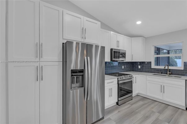 Interior, Kitchen, Recessed Lighting, Stainless Steel Appliances, Wood Texture Flooring