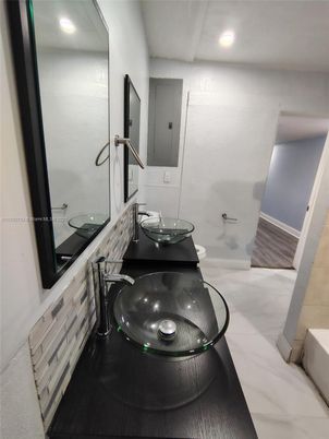 Bathroom, Dual Sink Vanities, Interior, Recessed Lighting, Wood Texture Flooring