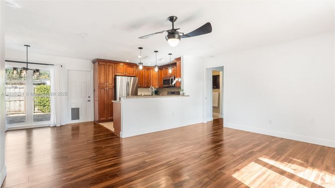 Empty room, Interior, Kitchen, Pendant Lights, Stainless Steel Appliances, Wood Texture Flooring