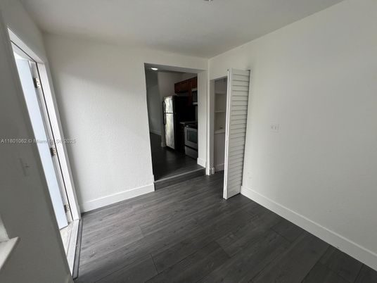 Empty room, Interior, Kitchen, Stainless Steel Appliances, Wood Texture Flooring