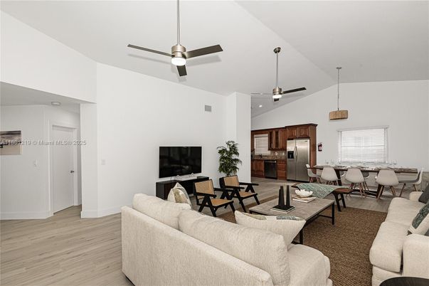 Dining room, Interior, Kitchen, Living room, Pendant Lights, Recessed Lighting, Stainless Steel Appliances, Wood Texture Flooring