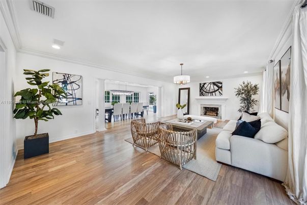 Dining room, Fireplace, Interior, Living room, Pendant Lights, Recessed Lighting, Wood Texture Flooring