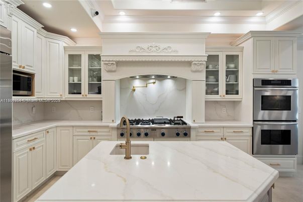 Interior, Kitchen, Marble Walls, Recessed Lighting, Stainless Steel Appliances