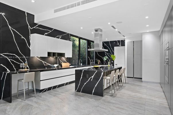Interior, Kitchen, Marble Walls, Recessed Lighting, Stainless Steel Appliances