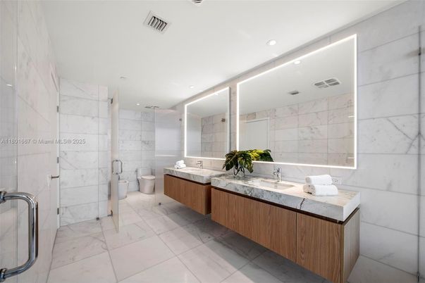Bathroom, Dual Sink Vanities, Glass Shower, Interior, Marble, Marble Walls, Recessed Lighting