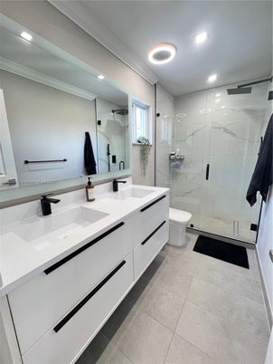 Bathroom, Dual Sink Vanities, Glass Shower, Interior, Marble Walls, Recessed Lighting