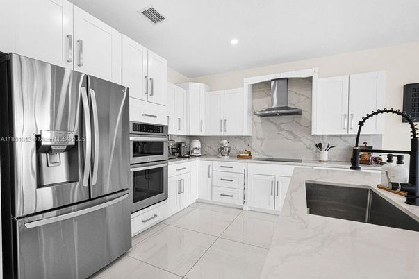 Interior, Kitchen, Marble, Marble Walls, Recessed Lighting, Stainless Steel Appliances