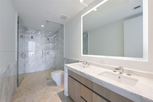 Bathroom, Dual Sink Vanities, Glass Shower, Interior, Marble Walls, Recessed Lighting