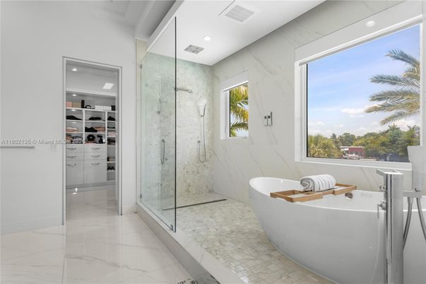 Bathroom, Free Standing Baths, Glass Shower, Interior, Marble, Marble Walls, Recessed Lighting