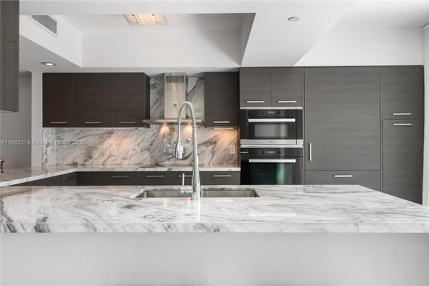 Interior, Kitchen, Marble Walls, Recessed Lighting, Stainless Steel Appliances