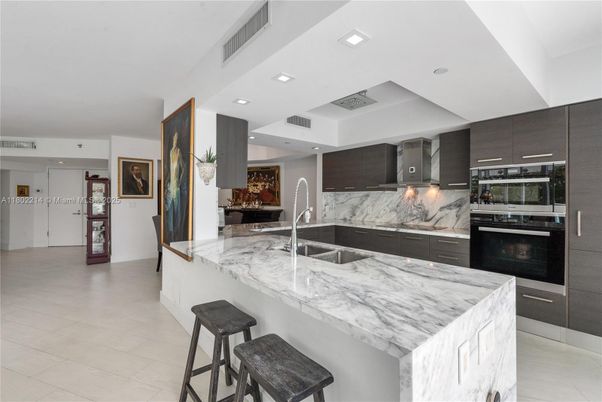 Interior, Kitchen, Marble Walls, Recessed Lighting, Stainless Steel Appliances