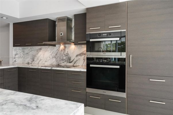 Interior, Kitchen, Marble Walls, Recessed Lighting, Stainless Steel Appliances