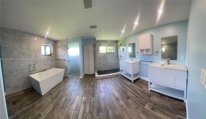 Bathroom, Dual Sink Vanities, Free Standing Baths, Glass Shower, Interior, Recessed Lighting, Wood Texture Flooring