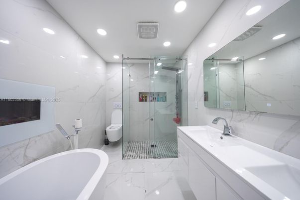 Bathroom, Dual Sink Vanities, Free Standing Baths, Glass Shower, Interior, Marble, Marble Walls, Recessed Lighting