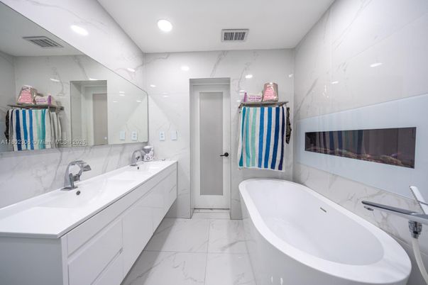 Bathroom, Dual Sink Vanities, Free Standing Baths, Interior, Marble, Marble Walls, Recessed Lighting