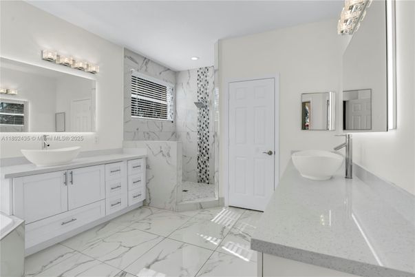 Bathroom, Dual Sink Vanities, Free Standing Baths, Interior, Marble, Marble Walls, Recessed Lighting