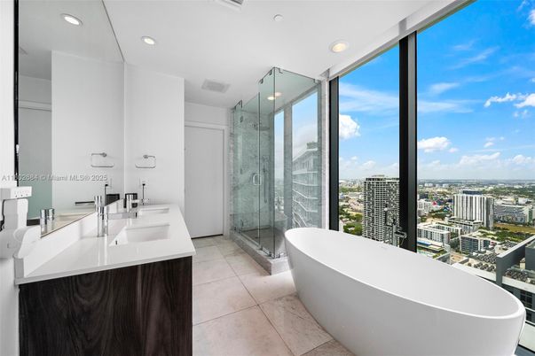 Bathroom, Dual Sink Vanities, Free Standing Baths, Glass Shower, Interior, Marble, Marble Walls, Recessed Lighting